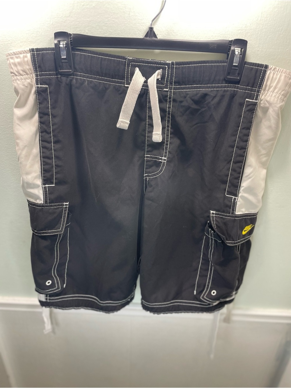 Black Nike vintage cargo board shorts feature white side panels